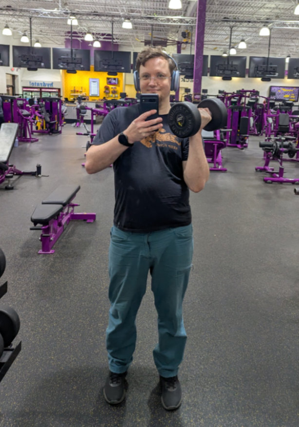 James with a dumbbell at the gym