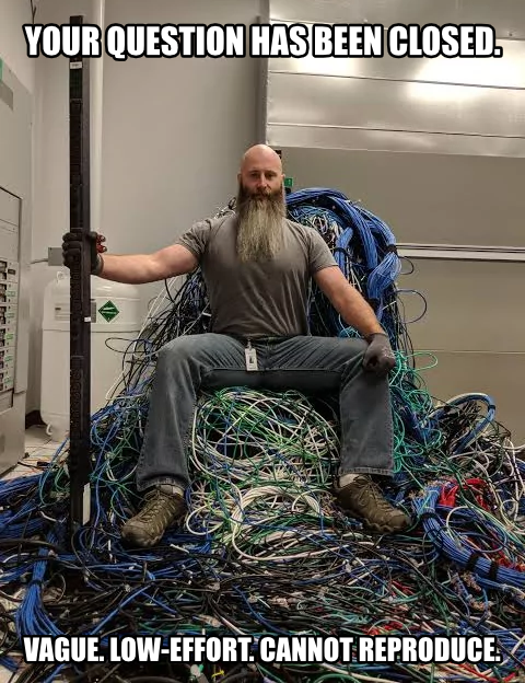 A programming wizard atop a throne of network cables. He intones 'Your question has been closed. Vague. Low-effort. Cannot reproduce.'